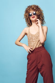 Cheerful woman woman with curly hair elegant style sunglasses decoration photo