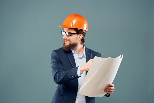 Man in safety suit orange helmet construction industry professional photo