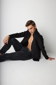 Handsome man fashionable hairstyle black jacket isolated background self-confidence portrait photo