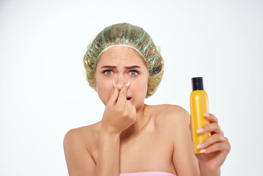 woman in shower cap pink towel skin care lotion photo