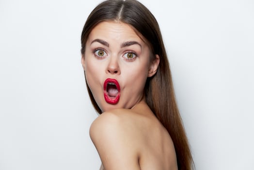 Woman Bare shoulders surprised facial expression open mouth Look Forward photo