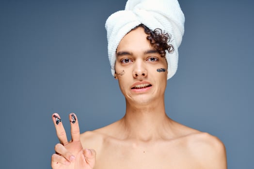 handsome guy with a towel on his head naked shoulders cosmetics clean skin photo