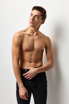 Handsome man nude inflated torso attractive look posing model photo