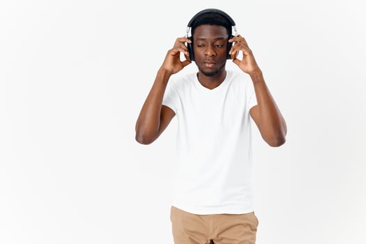 man of african appearance in headphones music technology isolated background photo