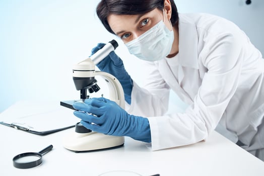 woman in laboratory medical mask diagnostics professional science photo
