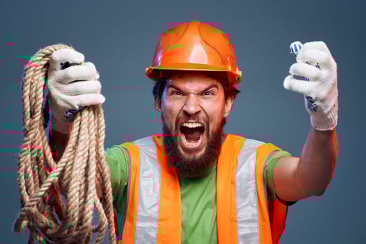 Screaming man cropped view of orange hard hat emotion professional photo