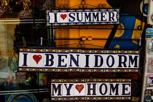 ceramic tiles souvenirs in a shop in the south of spain in a tourist town, colorful art crafts background photo