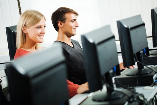 Students learning in a computer lab photo