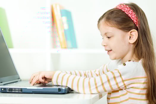 A girl using a laptop photo