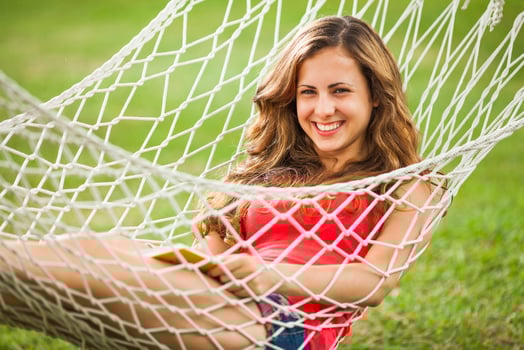 A young woman resting in a hammock photo