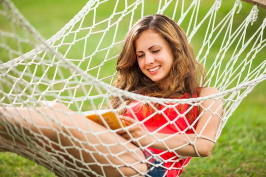 A young woman resting in a hammock photo