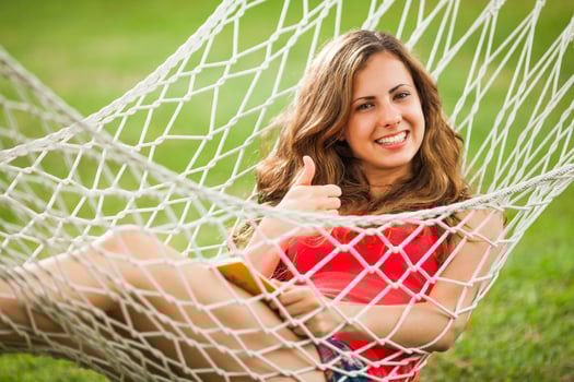 A young woman resting in a hammock photo