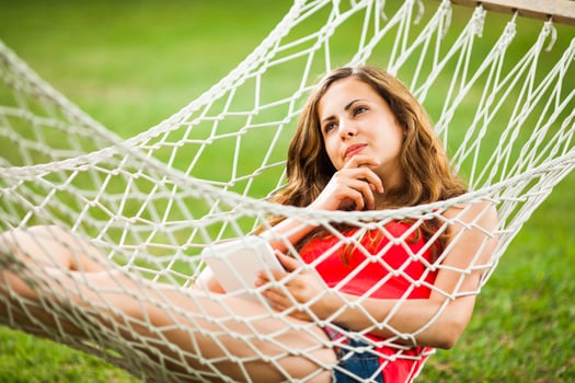 A young woman resting in a hammock photo
