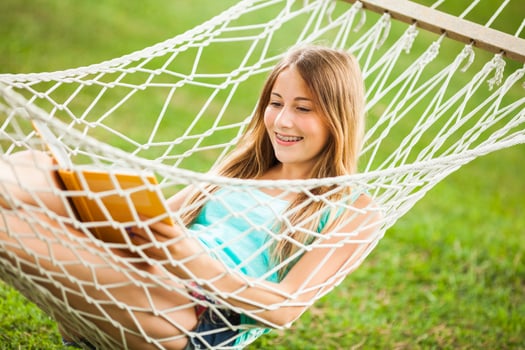 A young woman resting in a hammock photo