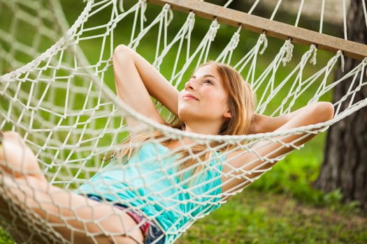 A young woman resting in a hammock photo