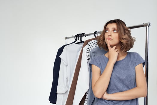 pretty woman clothing store buyer sale light background photo