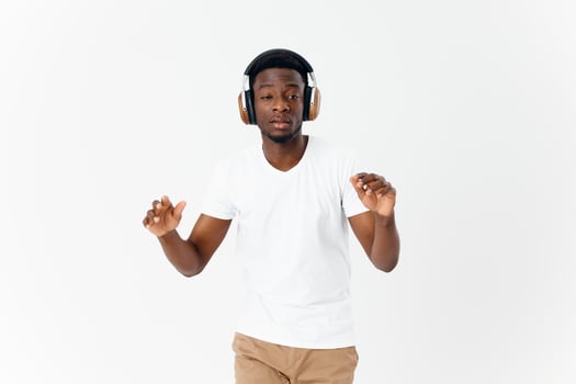 man african appearance in white t-shirt with headphones music modern style technology photo