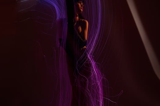 Positive young woman disco neon lines luxury fashion studio model unaltered photo