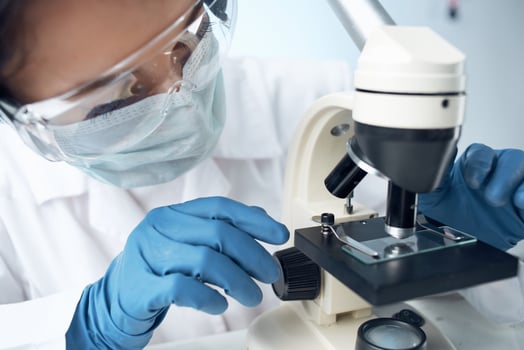 woman laboratory assistant microscope diagnostics research science photo