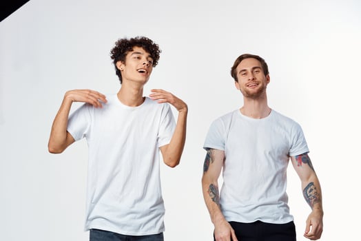 cheerful men in white t-shirts friendship emotions lifestyle photo