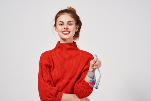 portrait of a woman in a red sweater Lifestyle light background photo