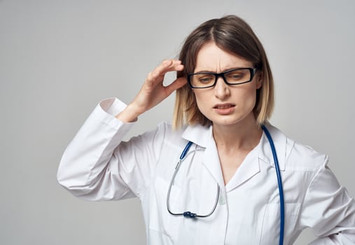 woman doctor with stethoscope gesturing with hands emotions glasses model photo
