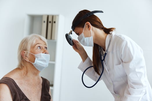 doctor in medical mask discussion with the patient medical specialist photo