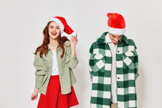 Guy in red hat and happy woman Christmas New Year Holidays photo