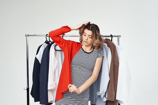 beautiful woman near clothes shopaholic studio emotion photo