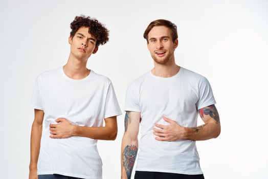 emotional two friends in white t-shirts yes fun studio photo