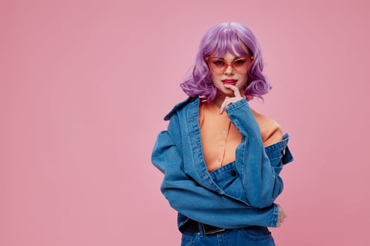 Portrait of a charming lady purple hairstyle red lips denim jacket fun color background unaltered photo