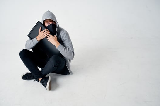 hacker crime anonymity caution balaclava isolated background photo