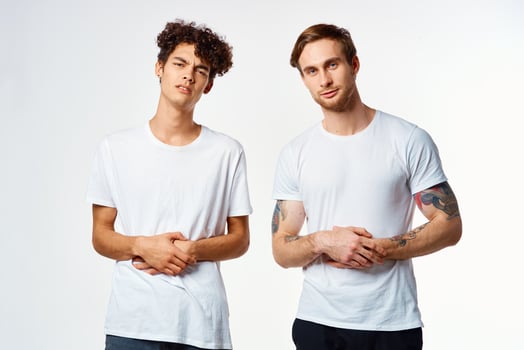 two funny friends in white t-shirts laughing positive emotions photo