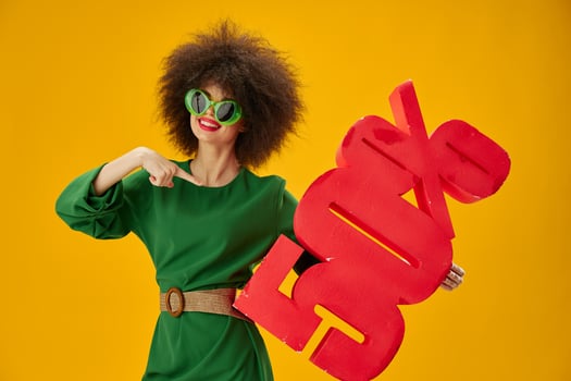 Positive young woman curly hairstyles green dress fifty percent discount studio model unaltered photo