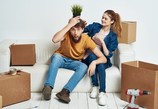 Married couple moving boxes with things lifestyle emotions interior photo