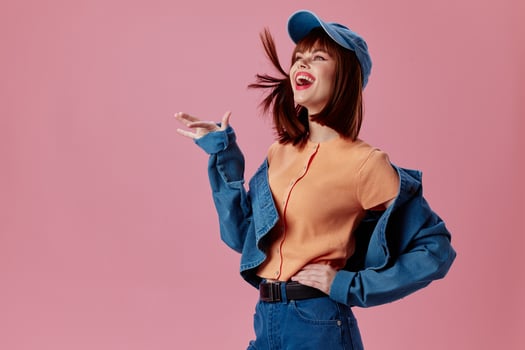 Pretty young female denim cap red lips glamor fashion studio model unaltered photo