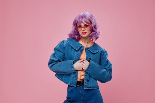 Beautiful fashionable girl denim clothing fashion posing cap pink glasses pink background unaltered photo