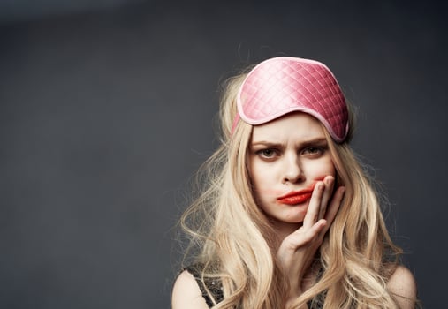 woman with pink mask on her head smeared red lipstick all over her face photo