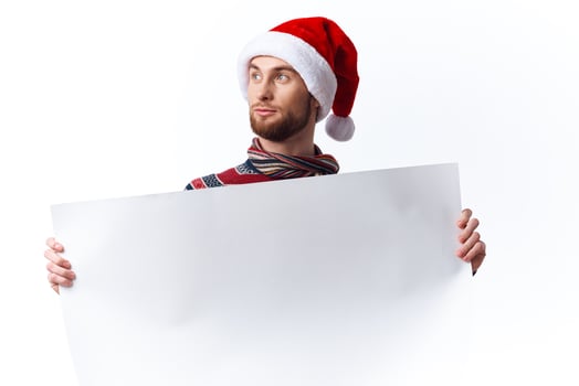 Cheerful man white paper billboard advertising copy-space studio photo