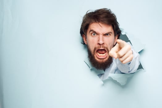 Angry man gestures with his hands dissatisfaction emotions work office photo