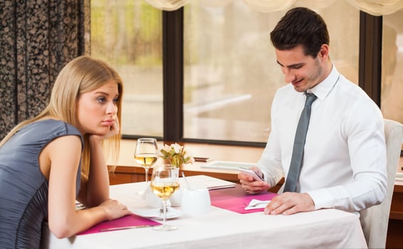 A couple having dinner at a restaurant photo