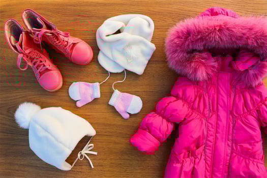 Children's winter clothes warm pink jacket, hat, scarf, mittens, boots photo