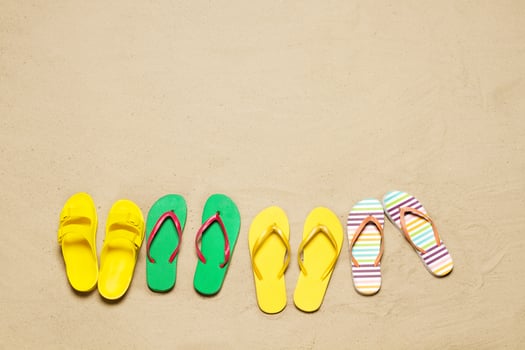 Sand beach texture background. Mockup summer vacation copy space. Set colorful flip flops. Blank template holiday funtime. Top view. Summertime accessories. Closeup seashore. Beachtime holidays photo
