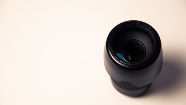 Camera lens on a white background. Close-up. Horizontal photo