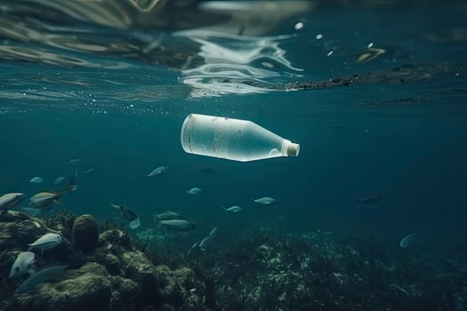 Plastic bottle floating in ocean with aquatic animal, fish. Pollution of plastic and Garbage in open sea concept photo