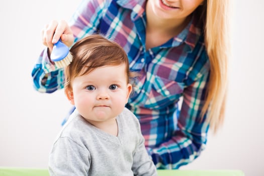 A mother taking care of her child photo
