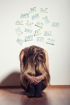 Depressed woman with her head down photo