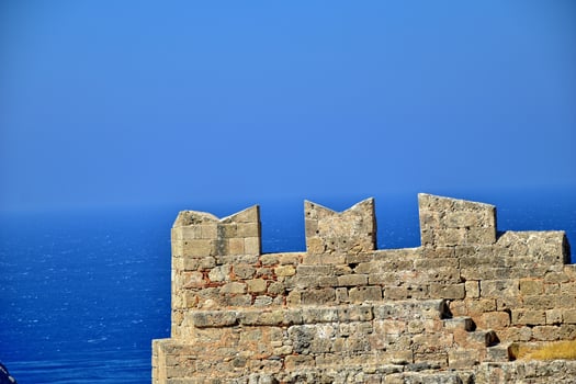 old antique stone ruins on a hot summer day on the Greek island of Rhodes in Lindos photo