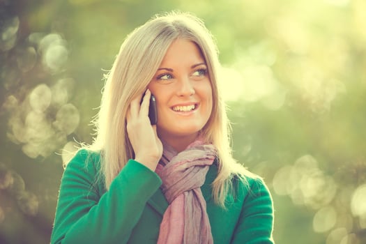 A woman talking on the phone photo