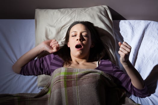 A young woman resting in the bed photo